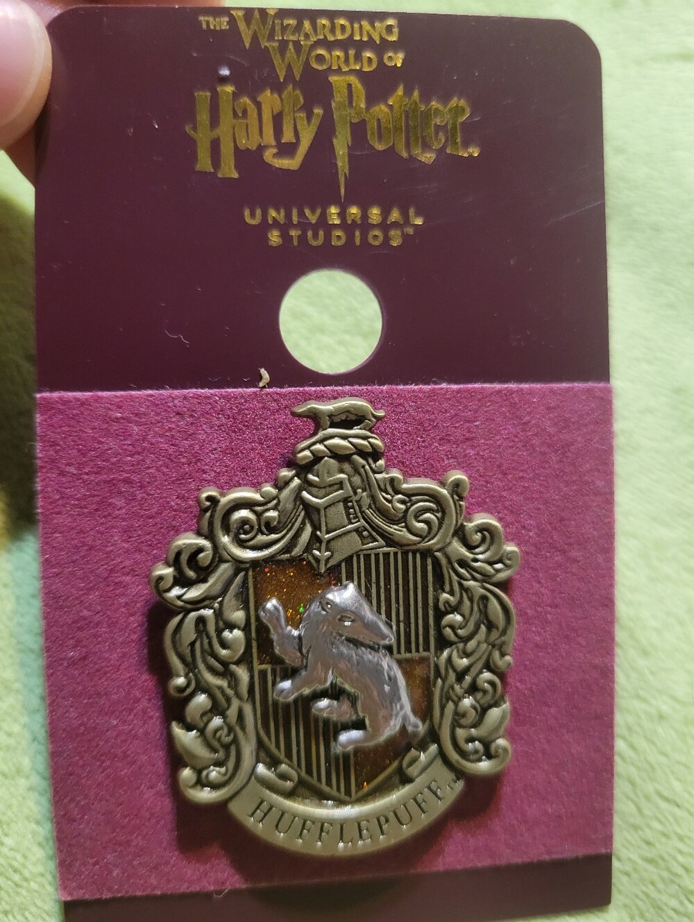 Hufflepuff house crest pin from The Wizarding World of Harry Potter New!